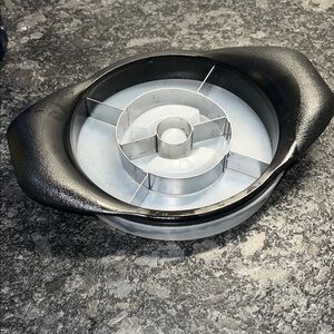 Pampered Chec Black and Silver Pineapple Slicer with protective cover.